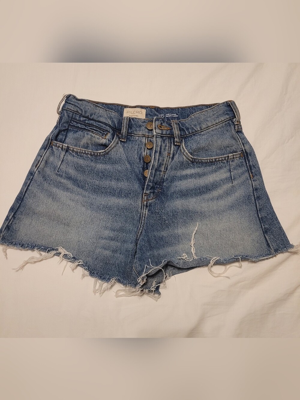 Pilcro Button-Front Distressed Denim Cutoff Shorts in Medium Blue